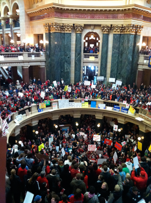 Thousands protest Gov. Walker's bill inside Wisconsin's capital rotunda. Photo: Joe Rowley