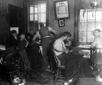 Workers in a sweatshop in Ludlow Street tenement, New York City, 1894. Minimum wage laws were propsoed to combat. Photo: Library of Congress