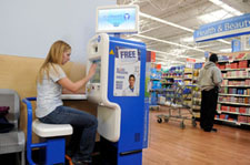The SoloHealth Station being tested in Wal-Mart stores gives consumers free and convenient access to health care by allowing them to screen their vision, blood pressure, weight, and body mass index -- or any combination of the four--in seven minutes or less for free, according to the manufacturer (Photo Jack Gruber/USA Today).