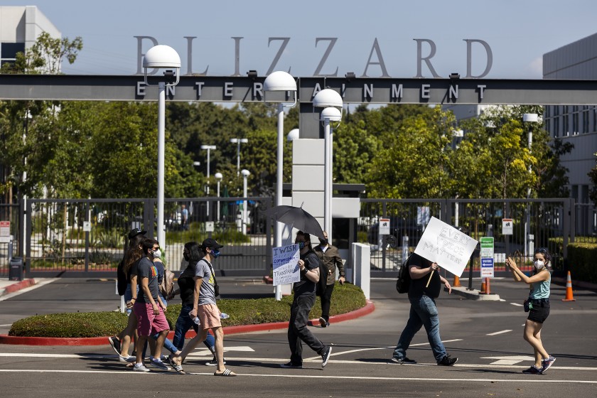 Irvine, CA - July 28: Several hundred Activision Blizzard employees stage a walkout which they say is in a response from company leadership to a lawsuit highlighting alleged harassment, inequality, and more within the company outside the gate at Activision Blizzard headquarters on Wednesday, July 28, 2021 in Irvine, CA. (Allen J. Schaben / Los Angeles Times)