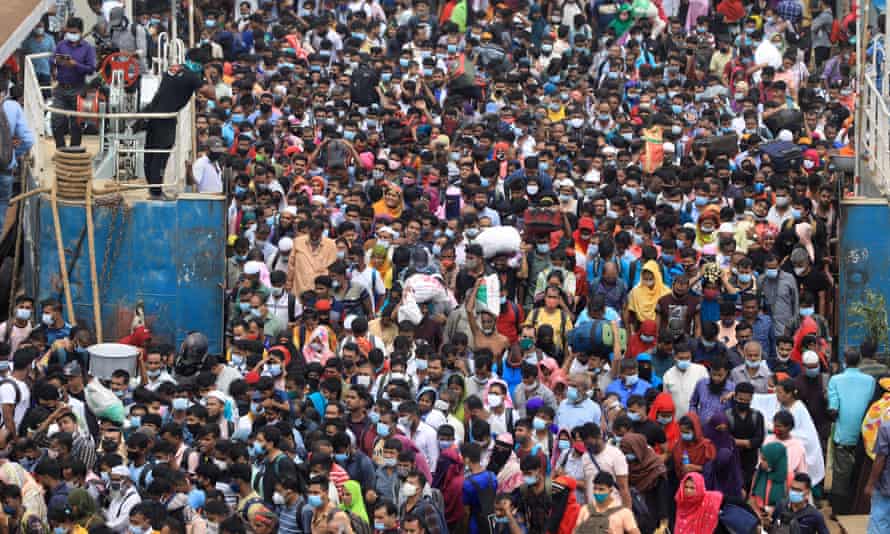 Thousands of people return to Dhaka using the Shimulia waterway in Bangladesh following the decision to reopen factories producing good for export.