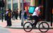 One of the increasing number of Deliveroo cyclist delivery riders on a sunny day in Manchester City Centre. We've released the image under Creative Commons. Use as you wish but please attribute by linking to www.shopblocks.com shopblocks - https://www.flickr.com/photos/155237687@N06/34720130102/